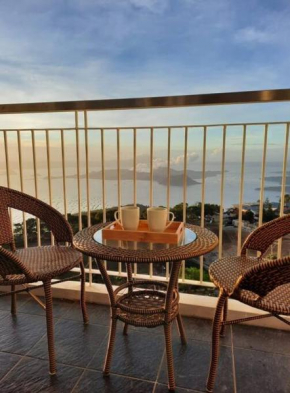 1 BR Cozy Farmhouse-Style Condo with Balcony & Taal View at Wind Residences